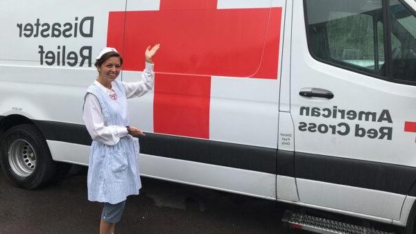 Photo of Amy Leopold with a Red Cross Emergency Response Van